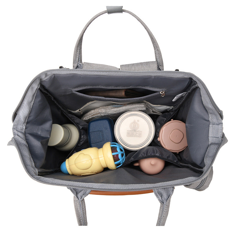 Sac à dos à langer bandes cuir caramel - vue intérieure avec compartiments