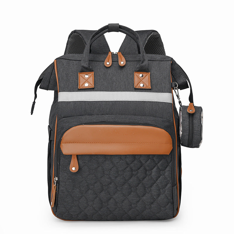 Sac à dos à langer matelassé gris foncé bandes cuir caramel