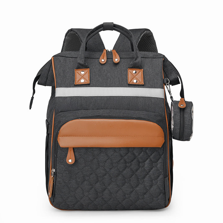 Sac à dos à langer matelassé gris foncé bandes cuir caramel