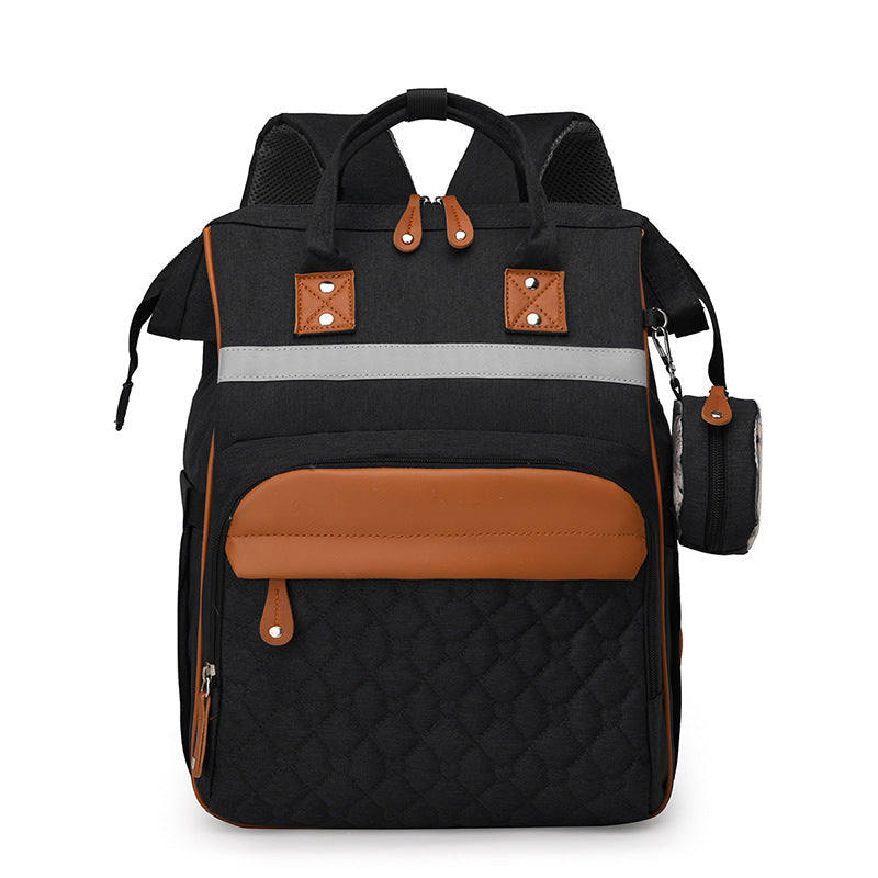 Sac à dos à langer matelassé noir bandes cuir caramel - finitions premium