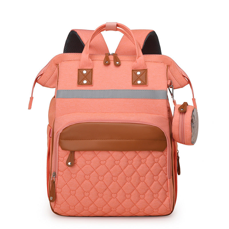 Sac à dos à langer matelassé rose poudré bandes cuir caramel - élégant