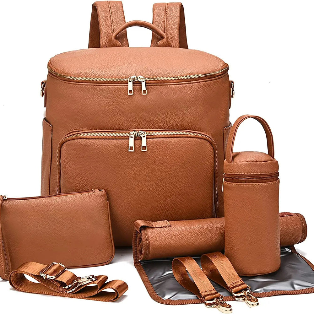 Sac à dos à langer en cuir Maison Lunö, coloris marron, avec ses accessoires