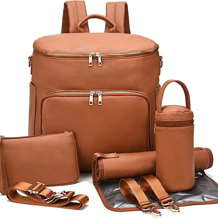 Sac à dos à langer en cuir Maison Lunö, coloris marron, avec ses accessoires